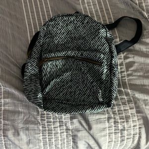 a light and dark blue mini backpack